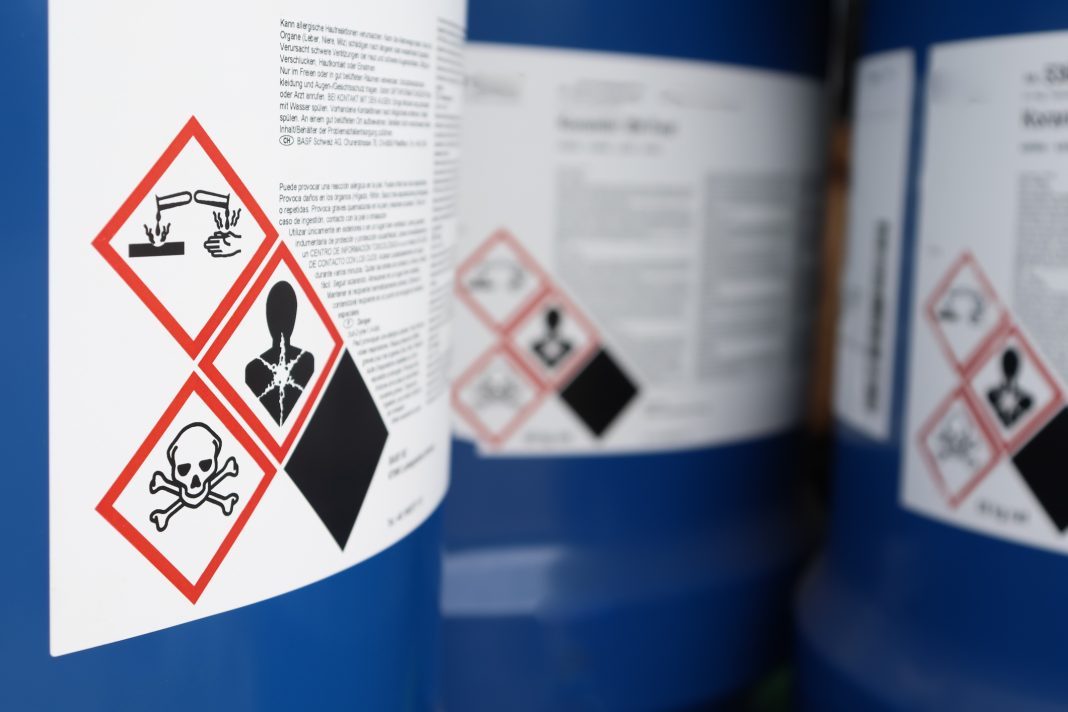 Bottle labels indicating type of toxicity of contents